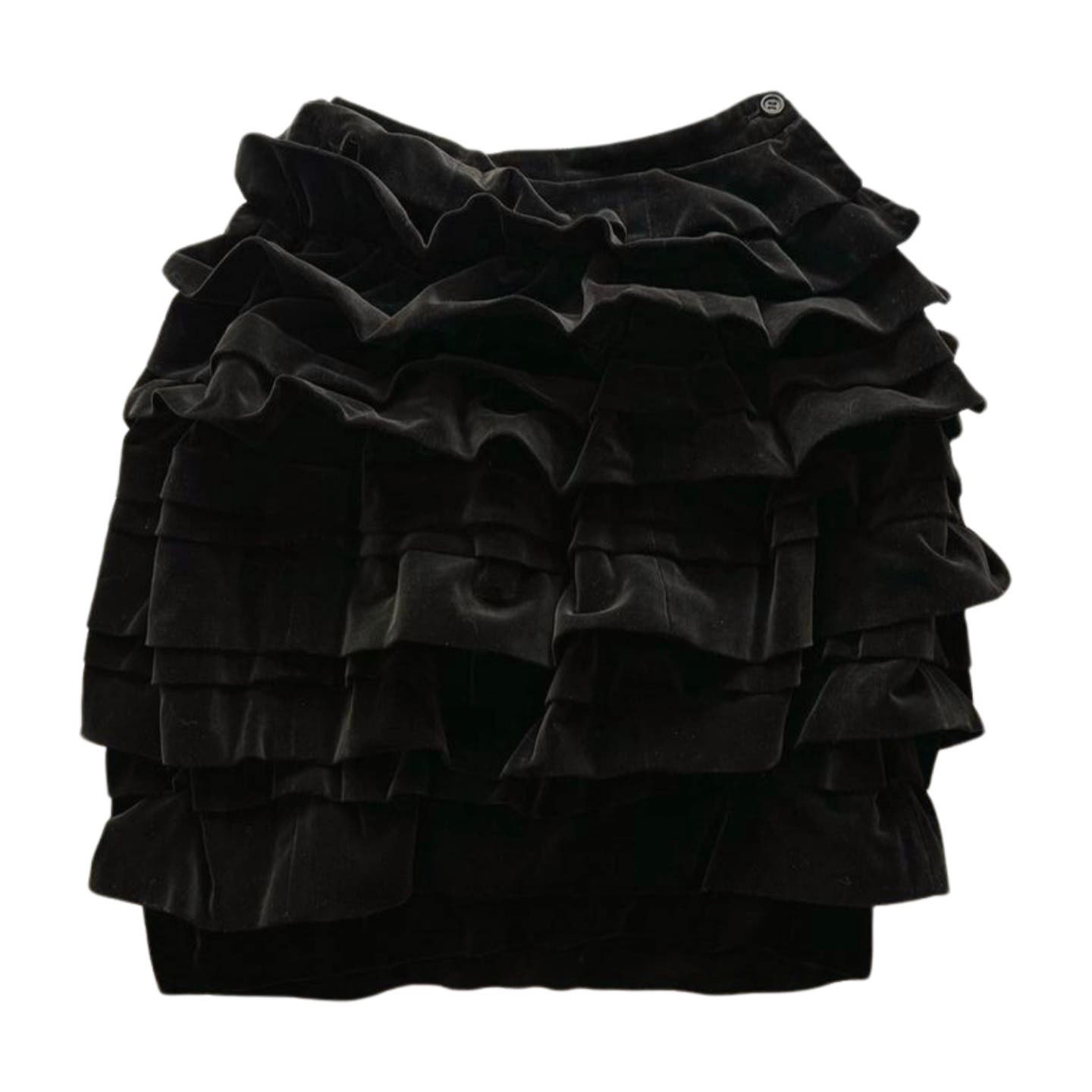A Vintage 1990 Comme des Garcons Skirt with multiple horizontal ruffles, creating a textured, layered appearance. The Comme des Garçons skirt has an elastic waistband and a button closure at the top on the side.