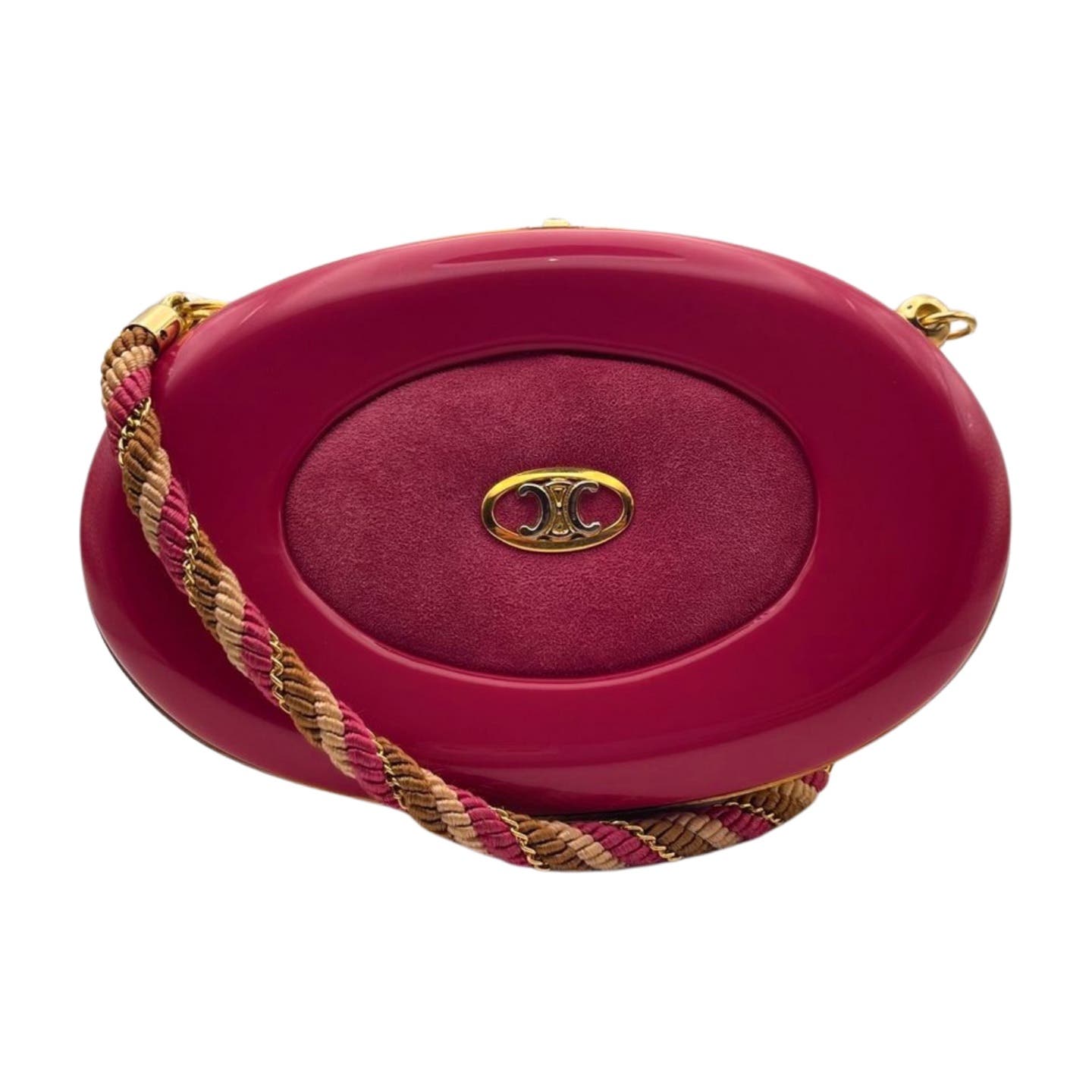 An oval-shaped designer handbag in glossy fuchsia with a center panel of textured fabric and a gold logo emblem. Featuring a multicolored, braided shoulder strap in pink, gold, and beige, this Vintage Celine Hard Shell Bag by Celine boasts an exquisite leather interior.